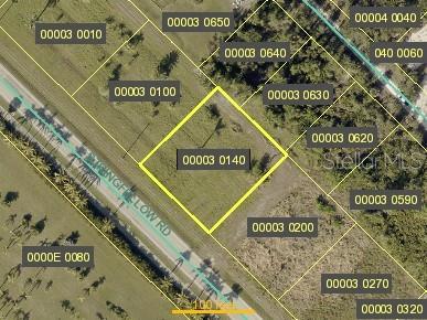 This is an aerial map showing a vacant lot outlined in yellow along a road — 13736 STRINGFELLOW ROAD, BOKEELIA, FL