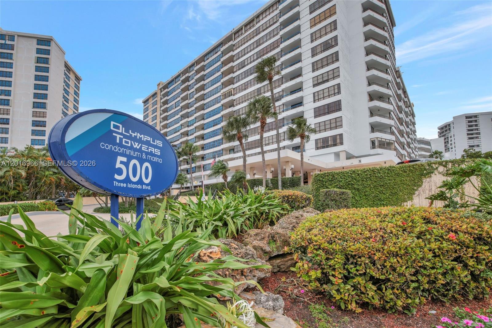 A sign for Olympus Towers stands in front of a large multi-story residential building — 500 Three Islands Blvd # 622, Hallandale Beach FL 33009, HALLANDALE BEACH, FL