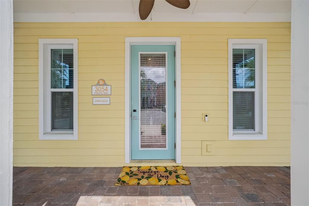 A bathroom features a glass-enclosed shower, a white toilet, and a vanity with teal walls — 3054 PIRATE WAY, KISSIMMEE, FL