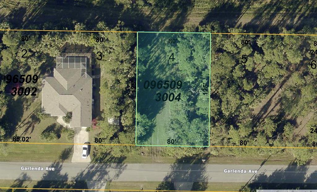 This is an aerial map showing a rectangular residential lot highlighted in green — GARLENDA AVENUE, NORTH PORT, FL