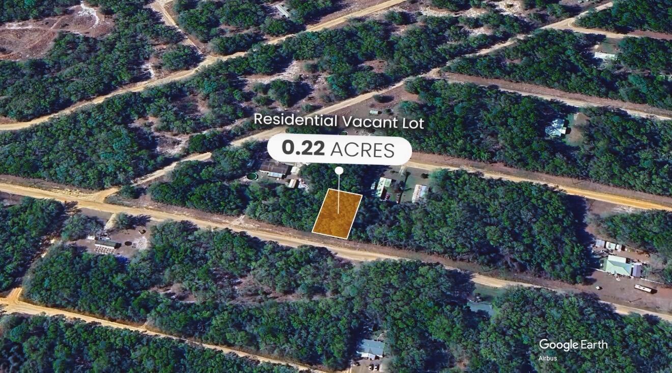 This aerial map view shows a highlighted 0.22-acre residential vacant lot surrounded by trees — 000 Wilson Dr Drive, FL 32148, FL