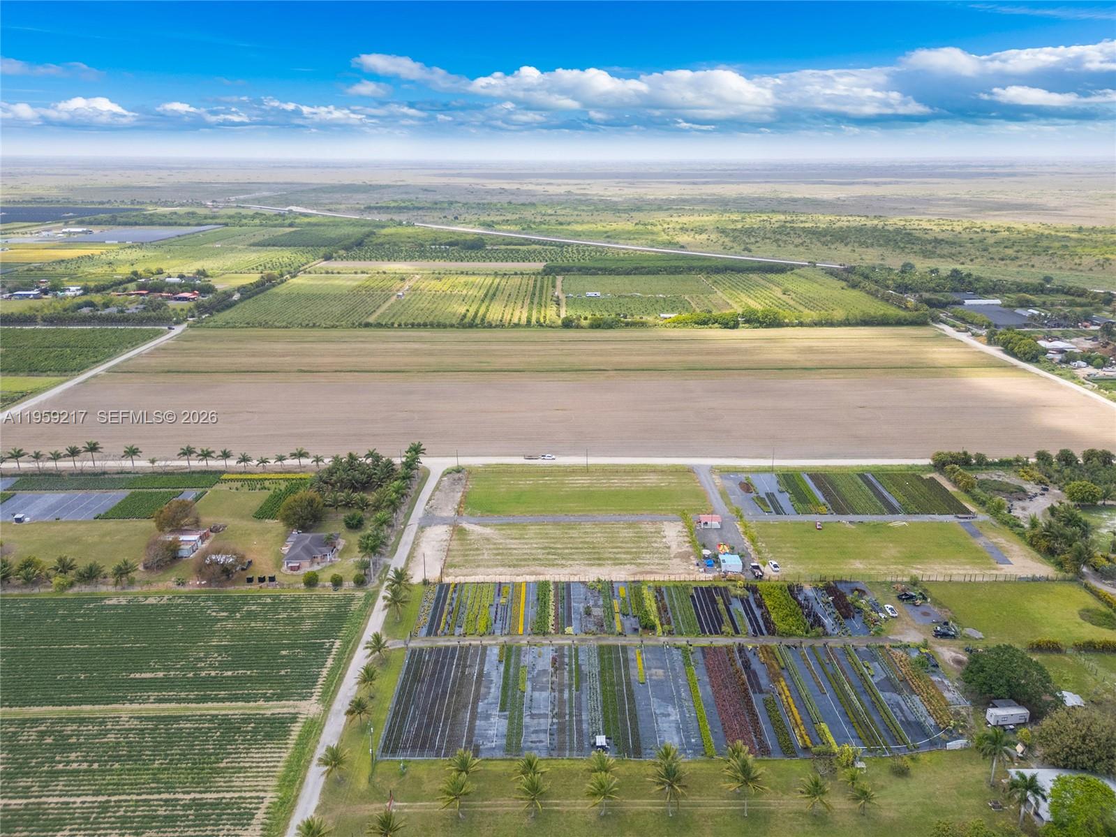 An aerial view shows a large agricultural property with fields, a nursery, and a house — 224XX sw 217ave, Miami FL 33170, MIAMI, FL