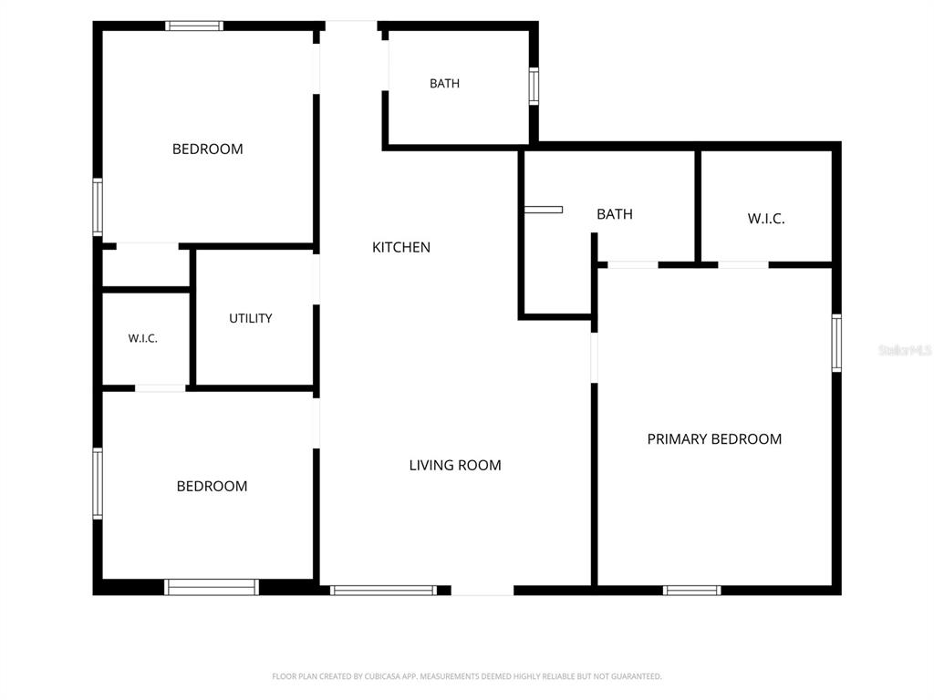 This is a floor plan showing a three-bedroom, two-bathroom home with a central living area — 7851 40 AVE N, ST PETERSBURG, FL