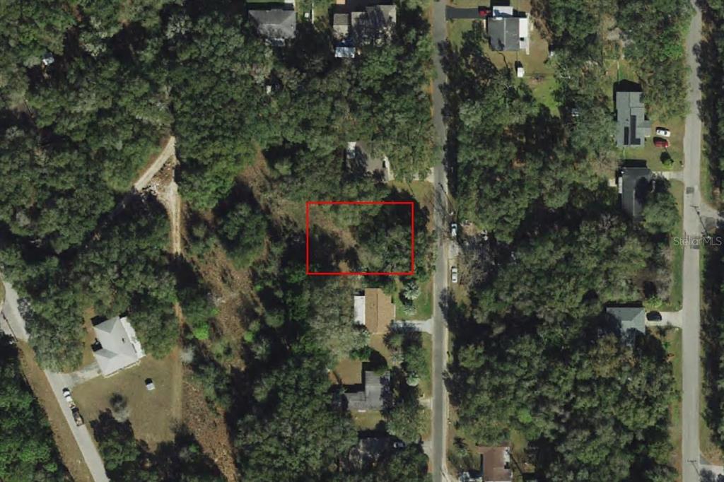 This is an aerial view of a rectangular plot of land outlined in red — 360 N WHEELER AVENUE, INVERNESS, FL