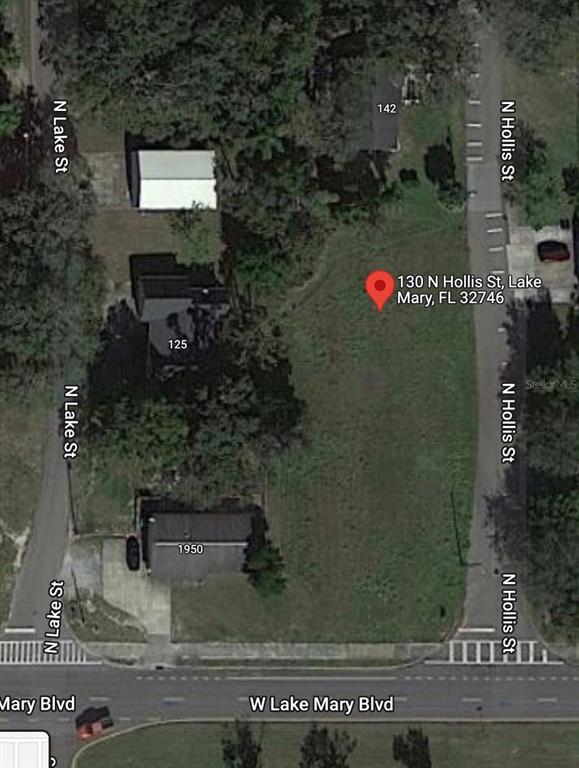 This is an aerial map view of a vacant lot located between two streets — 130 N HOLLIS STREET, LAKE MARY, FL