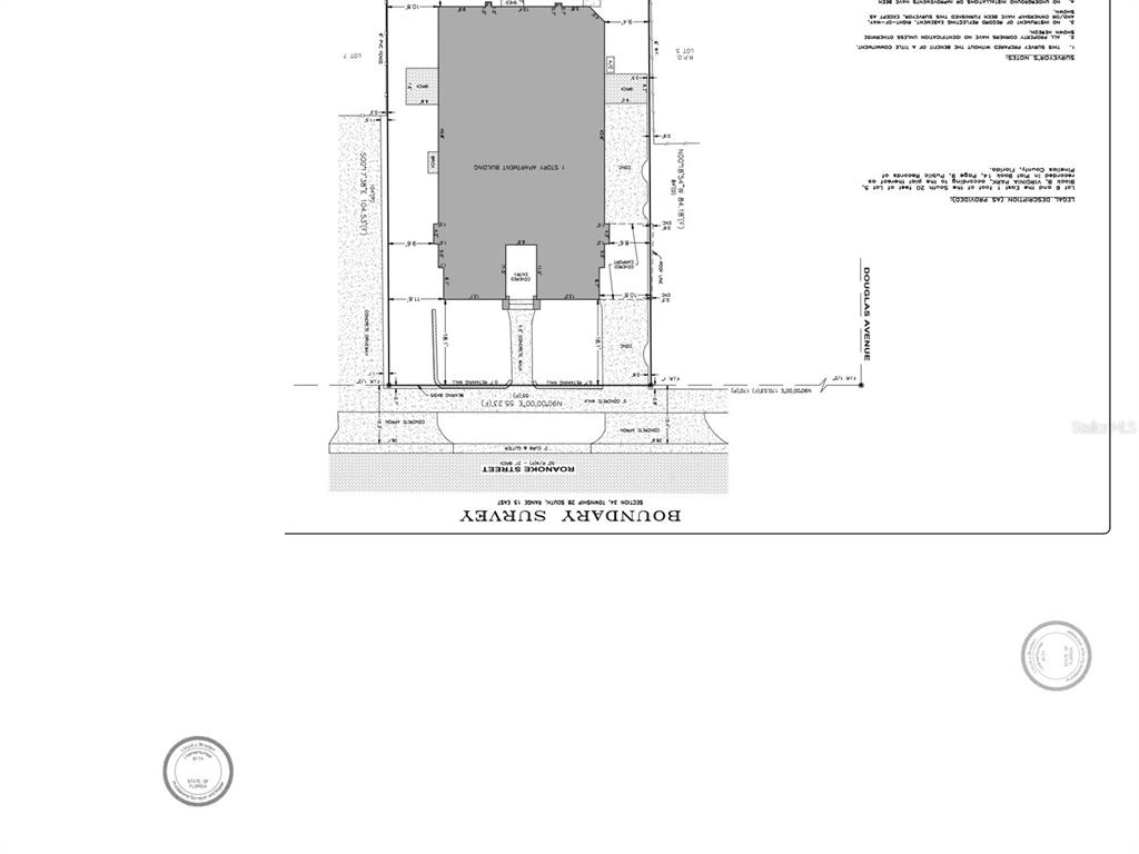 This is a boundary survey map showing the property lines and building footprint of a lot — 558 ROANOKE STREET, DUNEDIN, FL