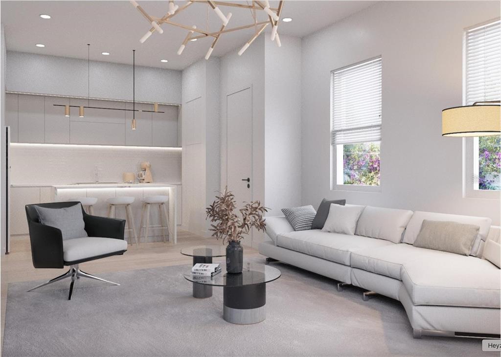 This rendering shows a modern open-concept living room and kitchen with white cabinetry and furniture — 6925 E 21ST AVENUE, TAMPA, FL