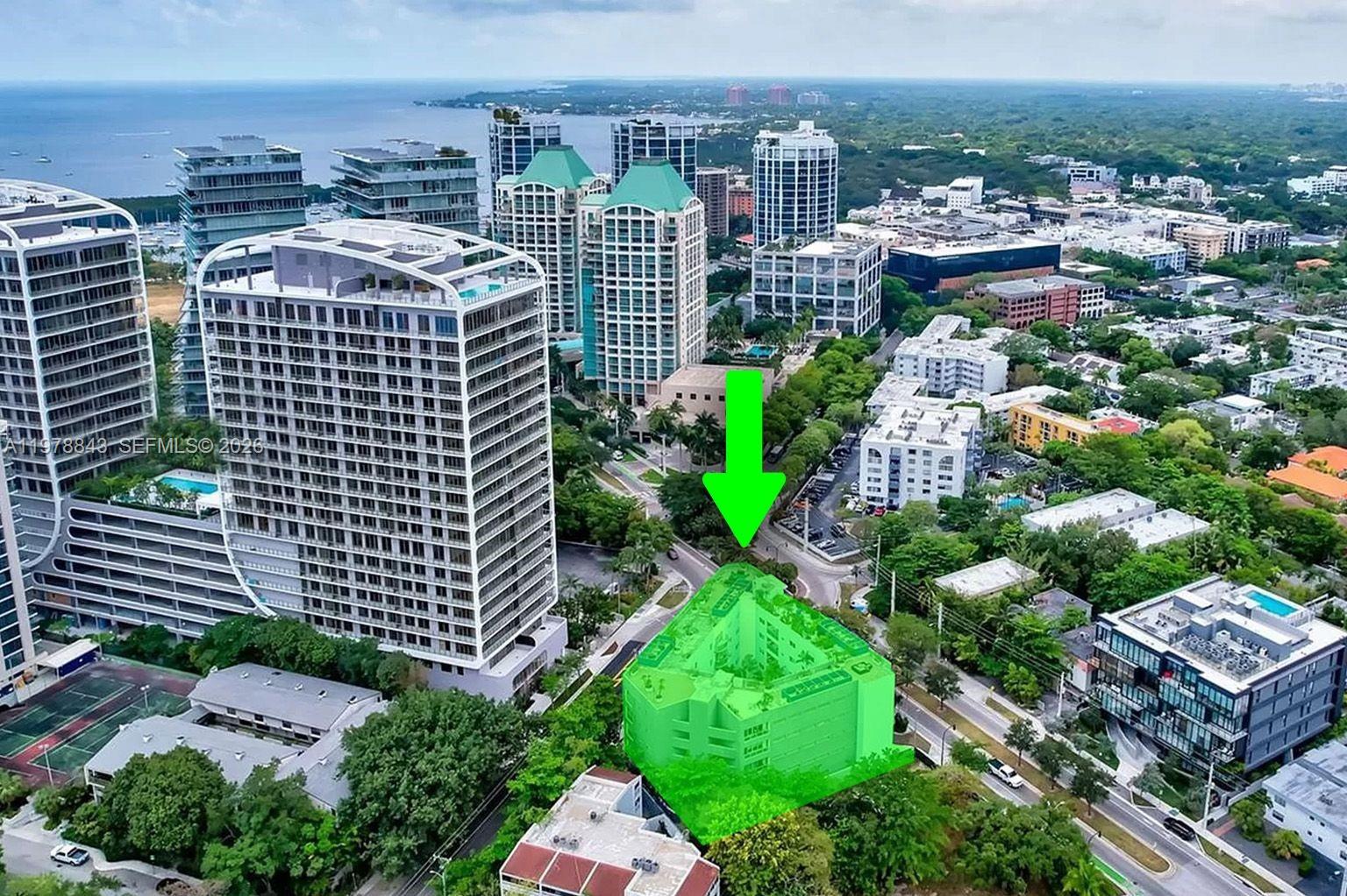 An aerial view shows a highlighted multi-story residential building surrounded by trees and urban development — 2699 Tigertail Ave # 14, Miami FL 33133, MIAMI, FL