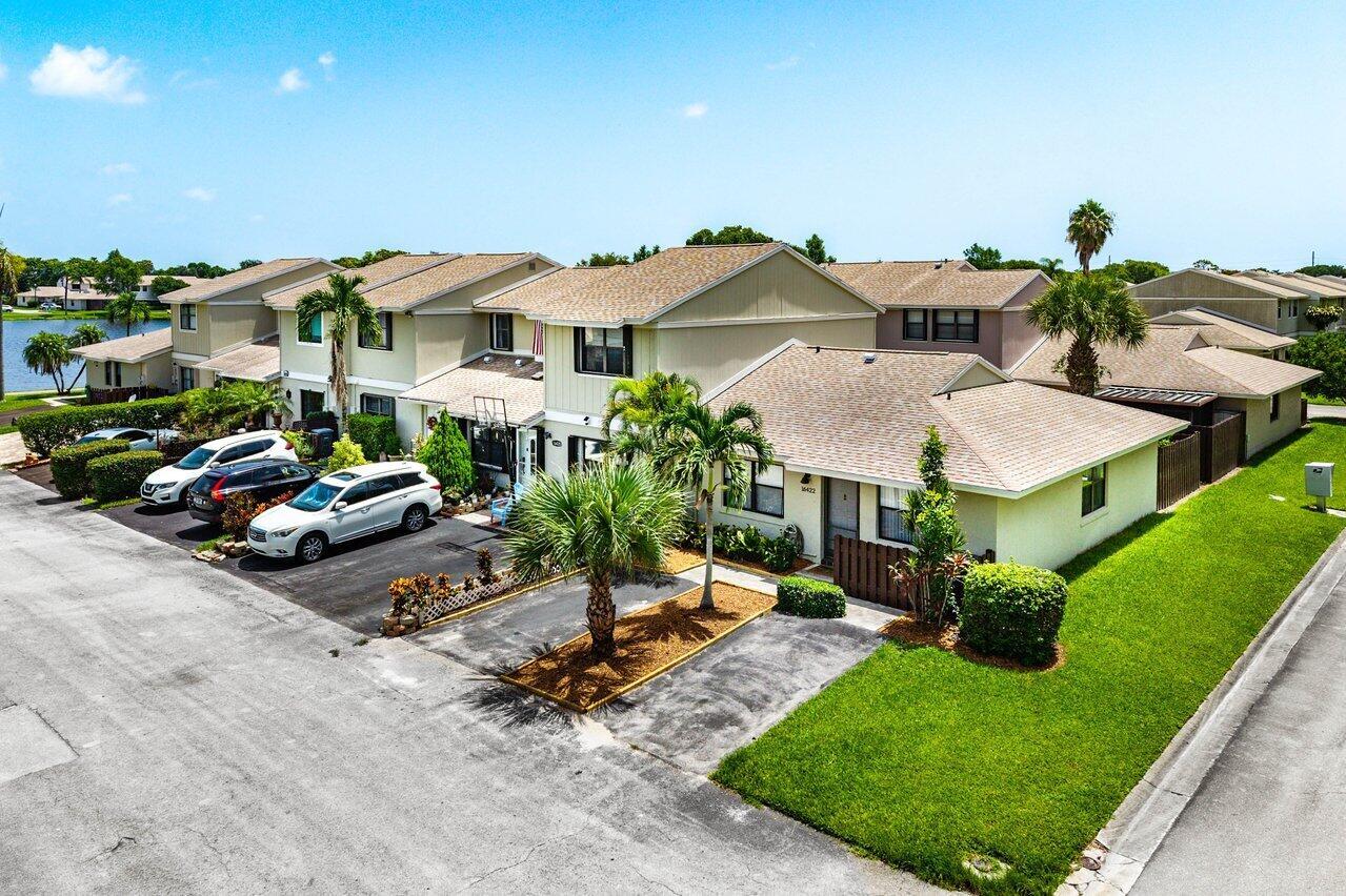 An aerial view of a multi-unit residential building with a driveway and palm trees — 16422 Straw Way, Delray Beach FL 33484, DELRAY BEACH, FL