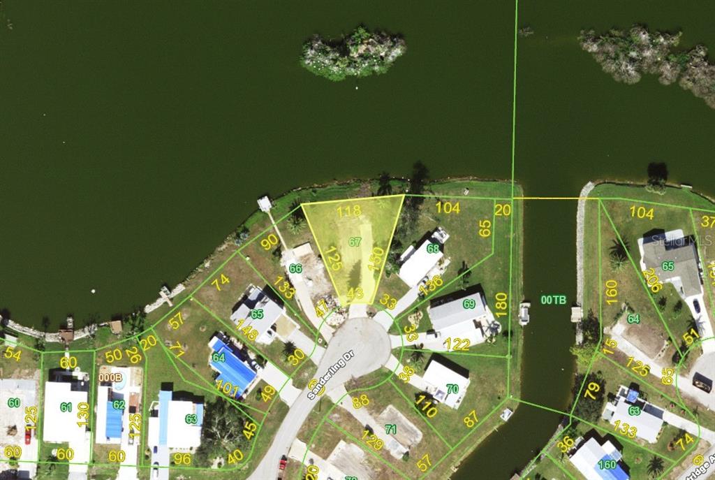 This is a satellite map showing residential lots along a cul-de-sac and a lake — 1303 SANDERLING DRIVE, ENGLEWOOD, FL