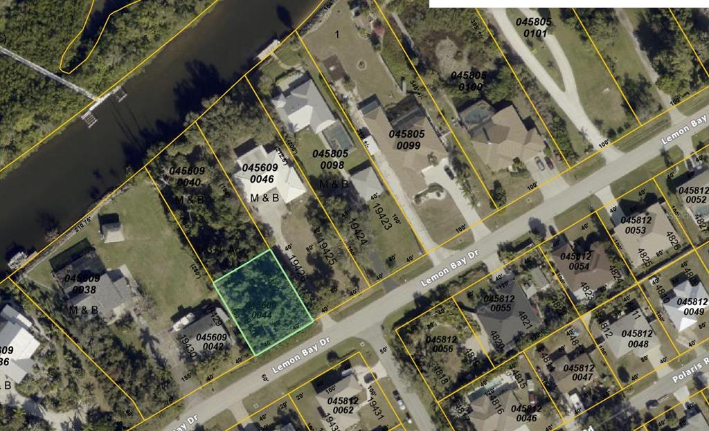 This is an aerial map showing residential lots and houses along a street and waterway — LEMON BAY DRIVE, VENICE, FL