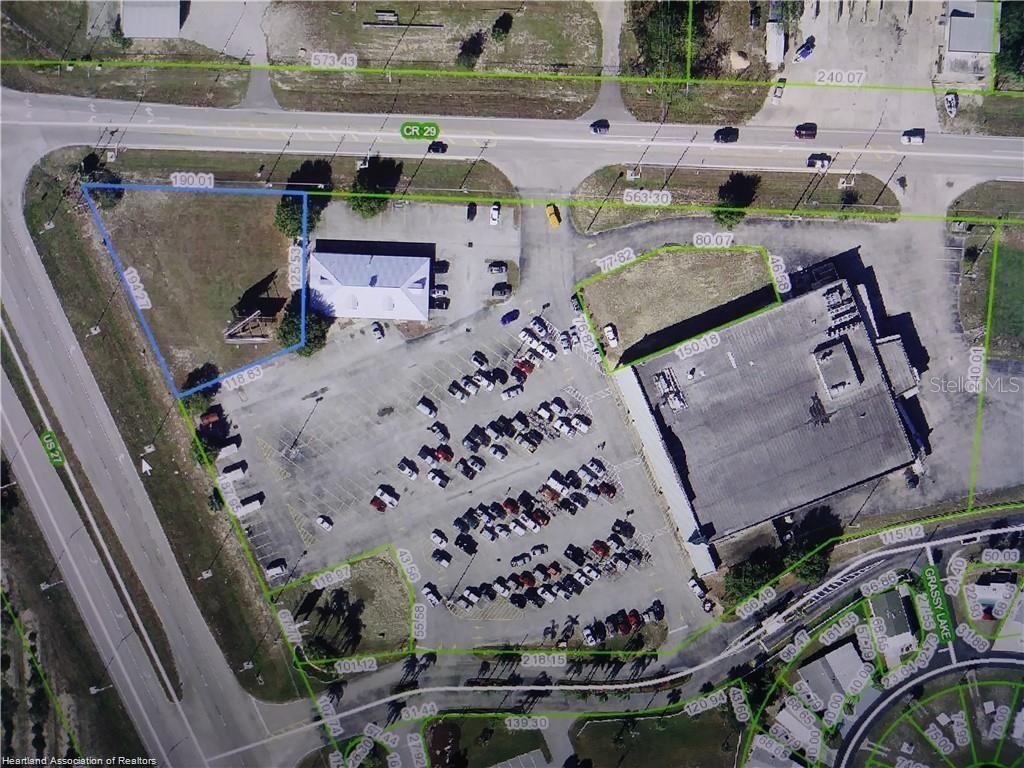 This aerial map shows a commercial property with a building, parking lot, and surrounding roads — 1503 US 27 S, LAKE PLACID, FL