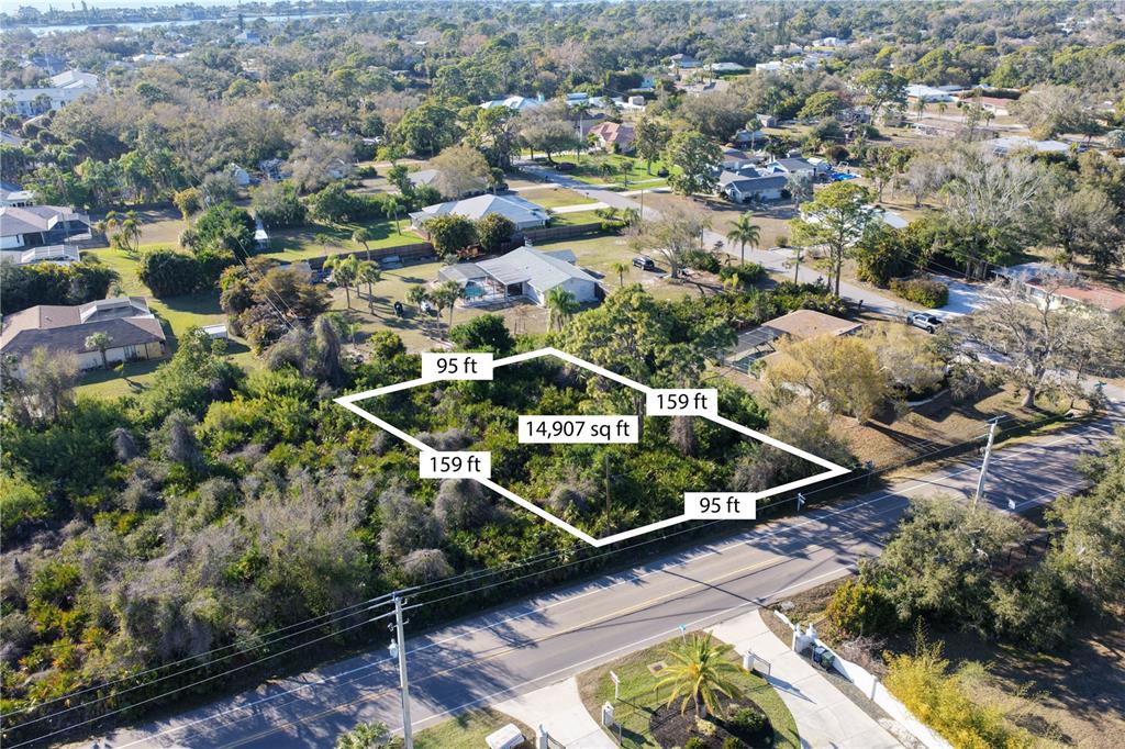 An aerial view shows a vacant, wooded rectangular lot outlined in white with dimensions — 0 MANASOTA BEACH ROAD, ENGLEWOOD, FL