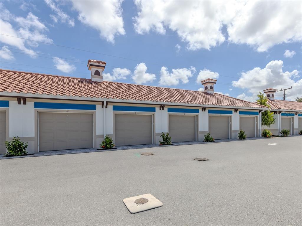 An aerial view shows a commercial building with a tiled roof, central courtyard, and parking — 787 S. TAMIAMI TRAIL UNIT 101, VENICE, FL