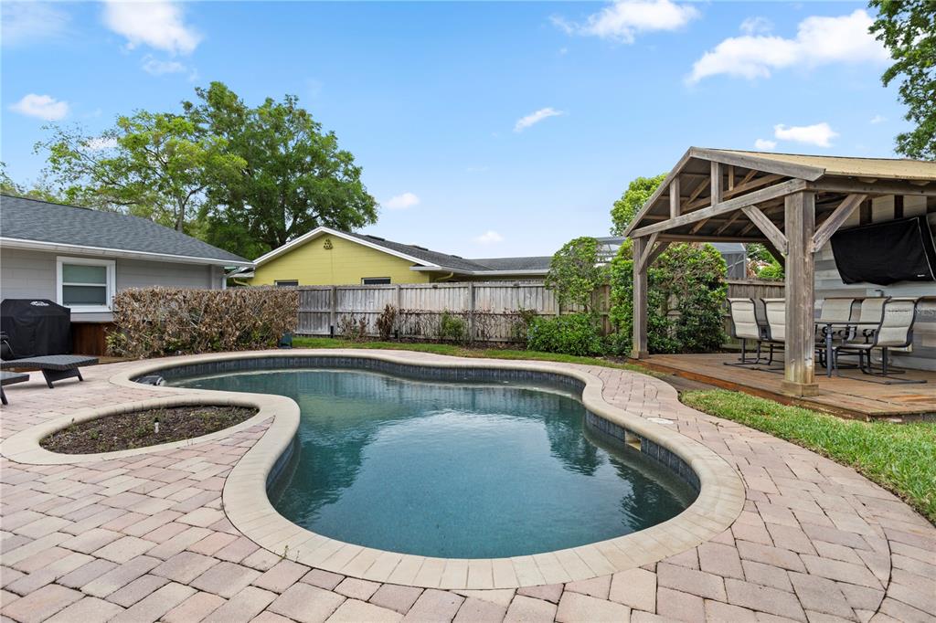 A single-story house with a gray exterior, a two-car garage, and a concrete driveway — 2130 DELORAINE TRAIL, MAITLAND, FL