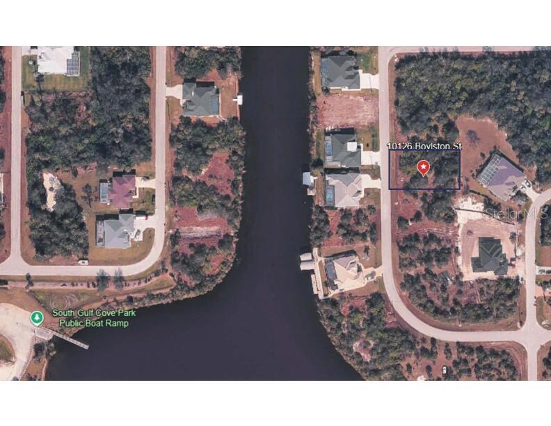 This aerial map shows a vacant residential lot located along a canal — 10126 BOYLSTON STREET, PORT CHARLOTTE, FL