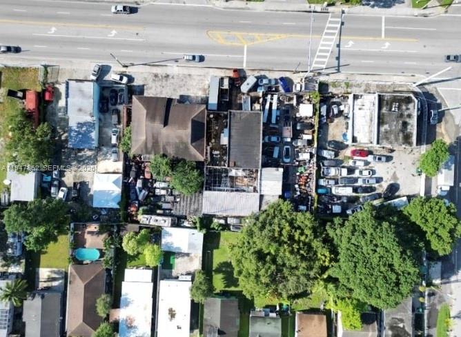 An aerial view shows a commercial property with multiple buildings and a parking lot — 3071 NW 54th St, Miami FL 33142, MIAMI, FL