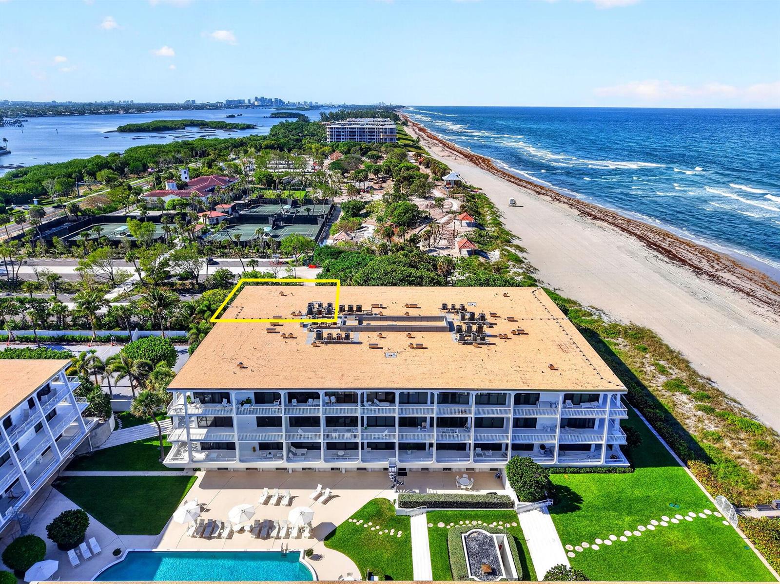 An aerial view of a multi-story beachfront condominium building with a flat roof and pool — 2275 S Ocean Boulevard # 305n, Palm Beach FL 33480, PALM BEACH, FL