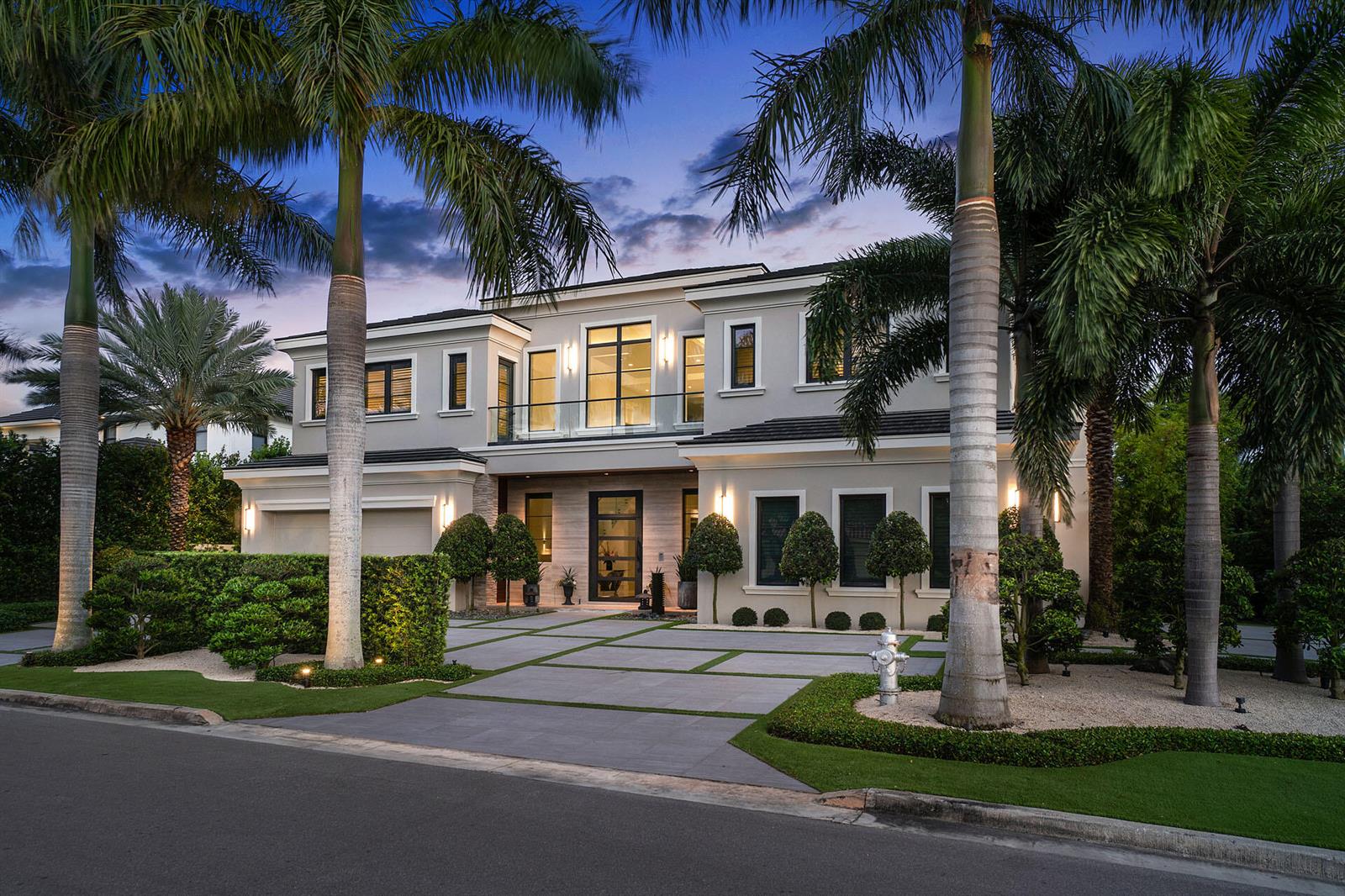 A two-story modern house with a paved driveway, palm trees, and a glass-paneled balcony — 290 S Maya Palm Drive, Boca Raton FL 33432, BOCA RATON, FL