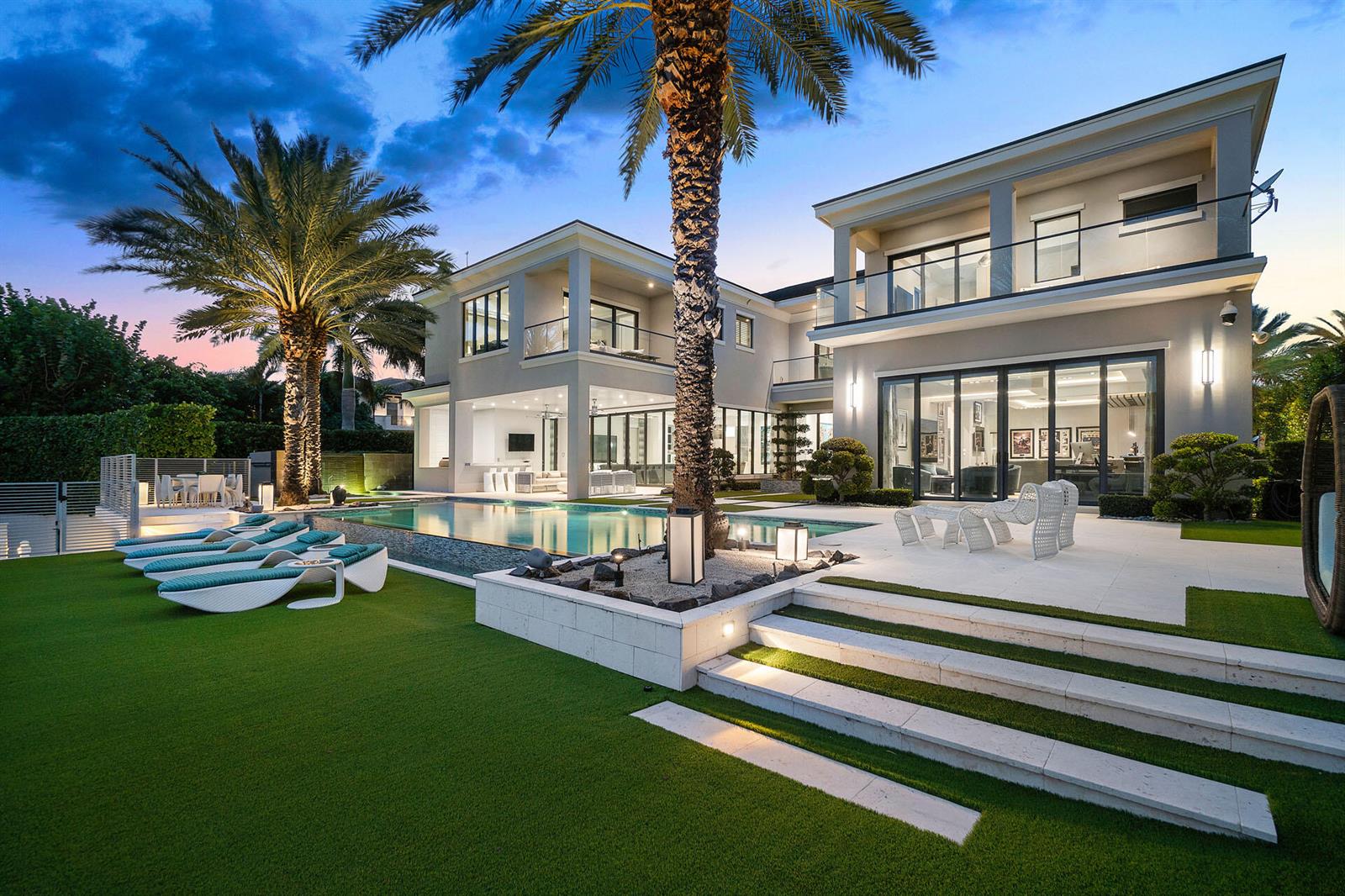 A modern two-story house features a swimming pool, palm trees, and a landscaped lawn — 290 S Maya Palm Drive, Boca Raton FL 33432, BOCA RATON, FL