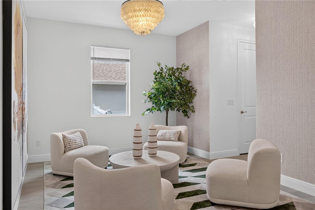 A sitting room features four cream-colored armchairs, a round coffee table, and a capiz chandelier — 2254 LOST HORIZON WAY, MINNEOLA, FL