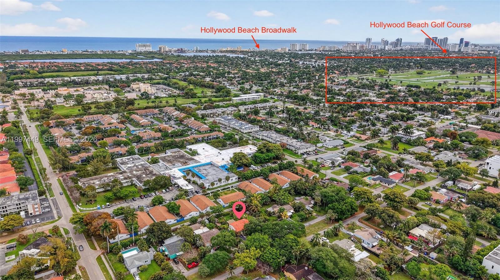 This aerial view shows a residential neighborhood with a highlighted house and golf course — 1601 N 16th Ct, Hollywood FL 33020, HOLLYWOOD, FL