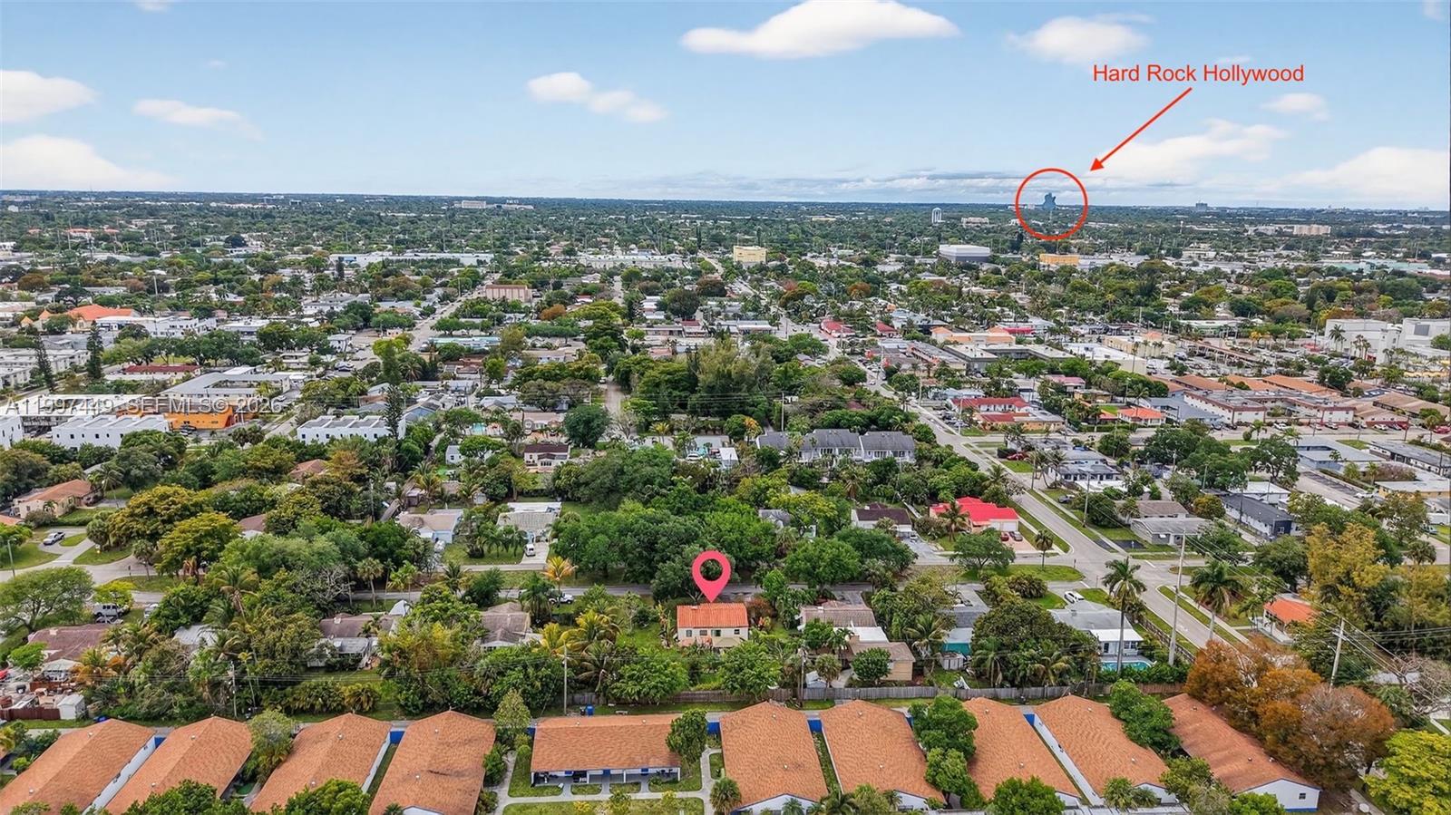 An aerial view of a residential neighborhood with a red pin marking a house — 1601 N 16th Ct, Hollywood FL 33020, HOLLYWOOD, FL