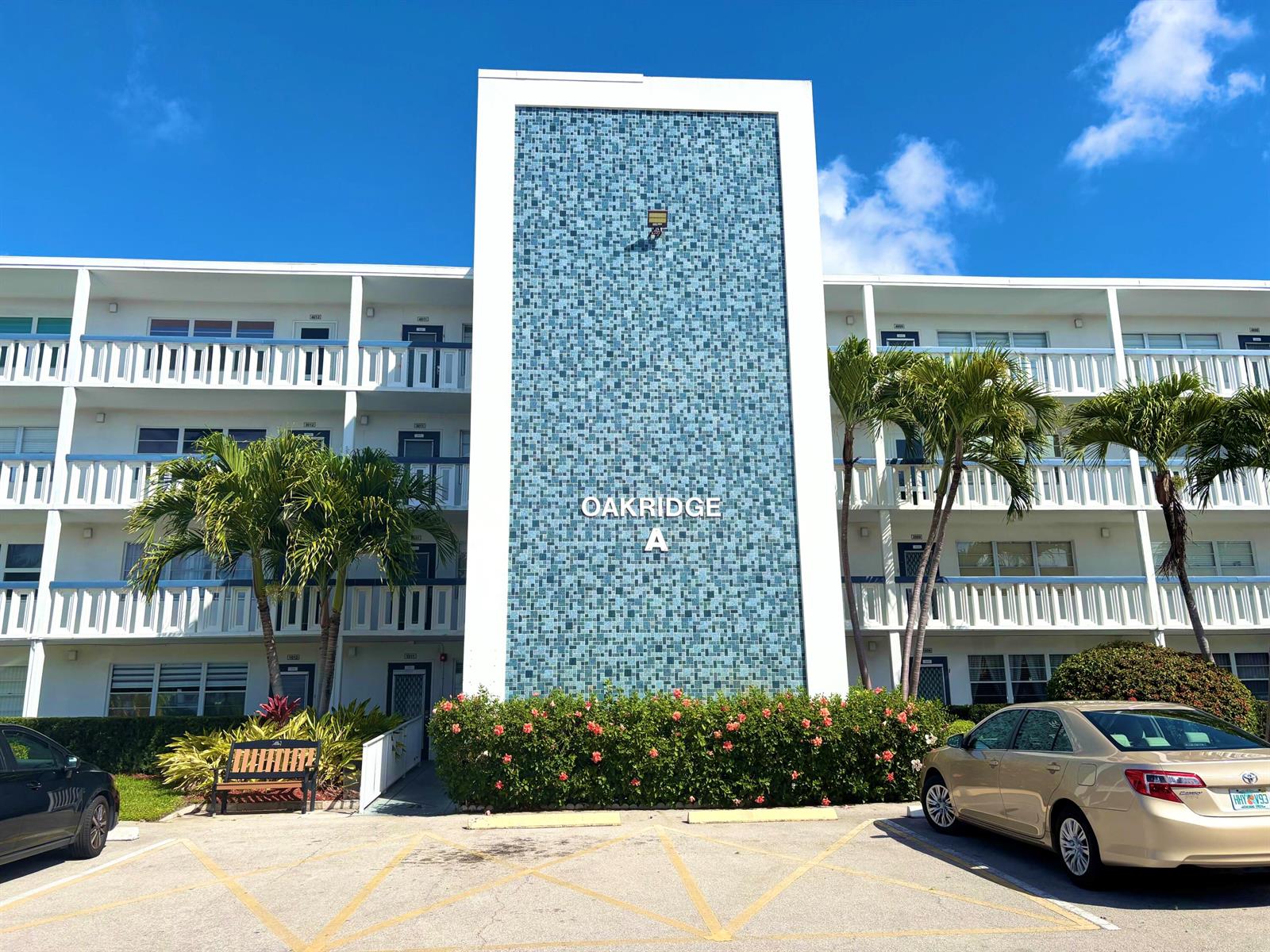 A three-story apartment building with a blue tiled facade labeled Oakridge A — 4015 Oakridge A # 4015, Deerfield Beach FL 33442, DEERFIELD BEACH, FL