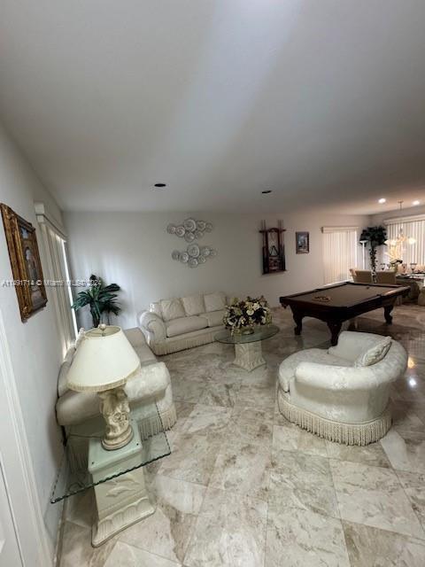A living room features a pool table, cream-colored furniture, and light-colored marble flooring — 3537 SW 175th Avenue, Miramar FL 33029, MIRAMAR, FL