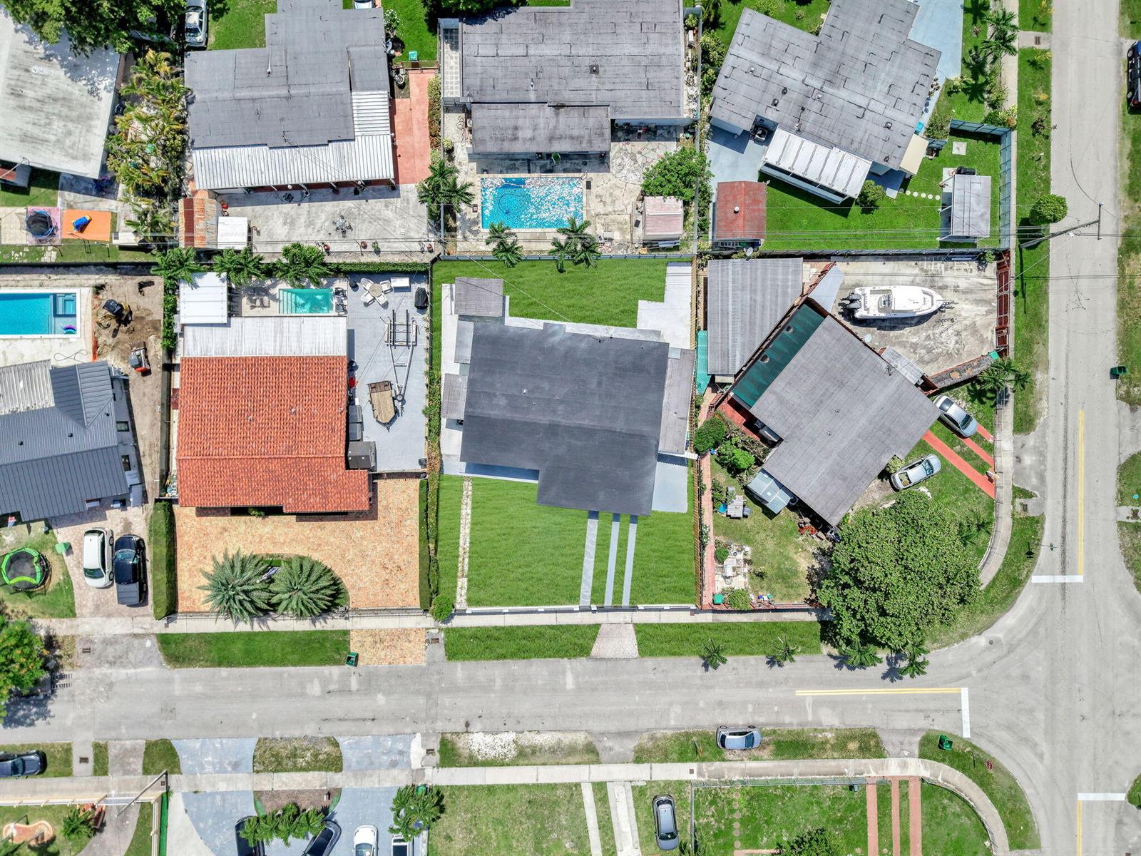 An aerial view shows three residential properties with pools, driveways, and landscaping along a street — 4040 SW 108th Avenue, Miami FL 33165, MIAMI, FL