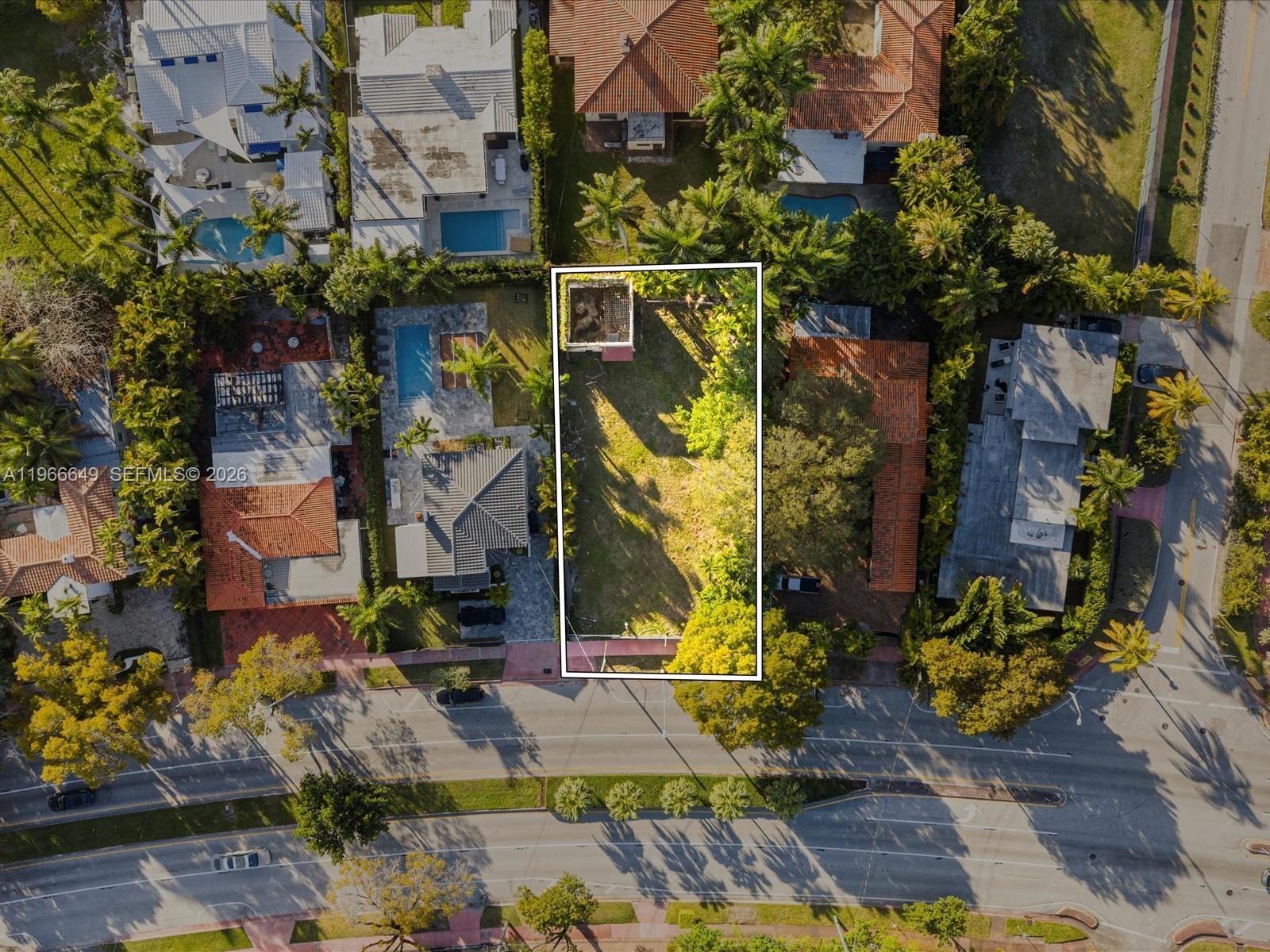 An aerial view shows a rectangular vacant lot situated between two residential properties — 5838 Alton Rd, Miami Beach FL 33140, MIAMI BEACH, FL