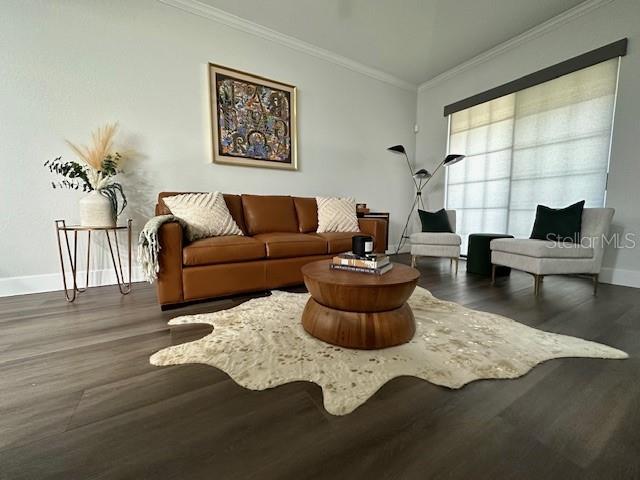 A living room features a brown leather sofa, a cowhide rug, and a modern armchair — 107 BRADFORD BEACH COURT UNIT 107, TAMPA, FL