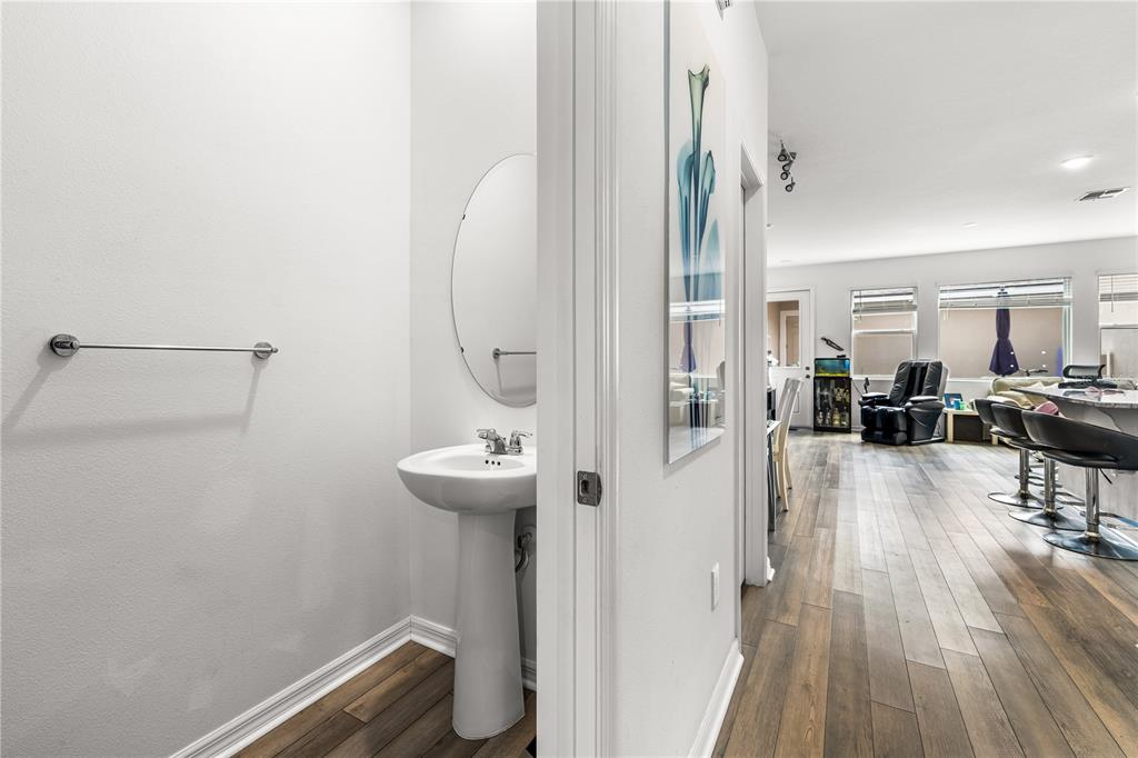 A kitchen features white cabinets, granite countertops, a center island, and stainless steel appliances — 16461 PRAIRIE SCHOOL DRIVE, WINTER GARDEN, FL
