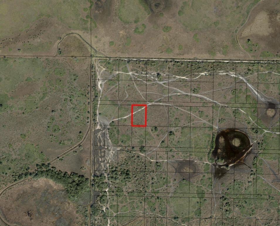 This is an aerial map showing a rectangular plot of land highlighted in red — 0 NW 318th Street, Okeechobee FL 34972, OKEECHOBEE, FL