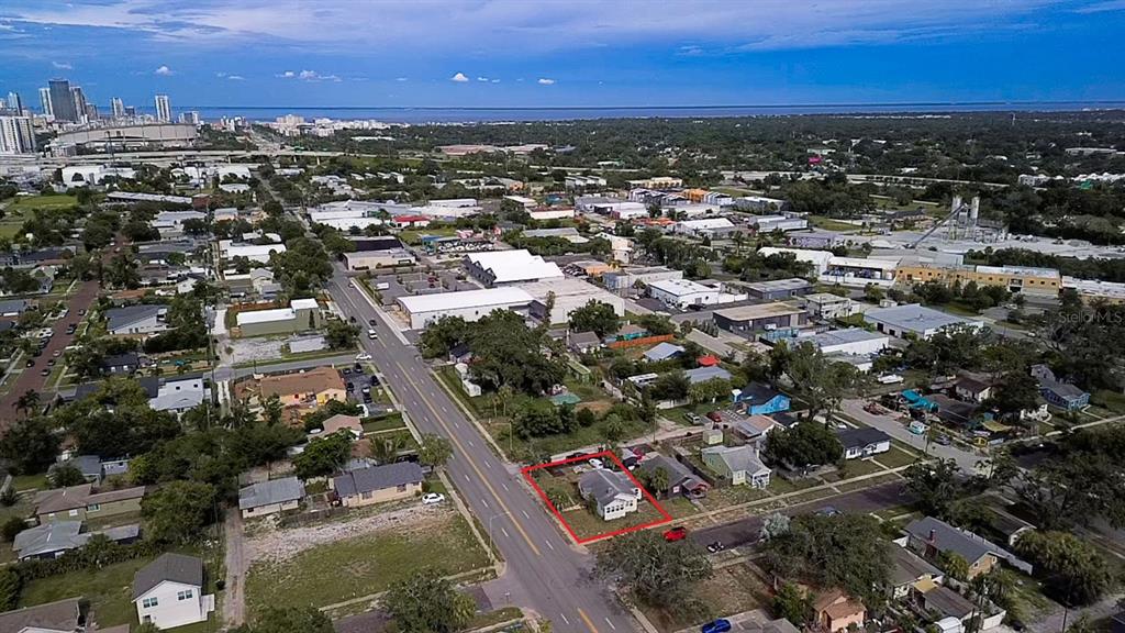 An aerial view shows a single-story house outlined in red on a residential street — 2560 5TH AVENUE S, ST PETERSBURG, FL