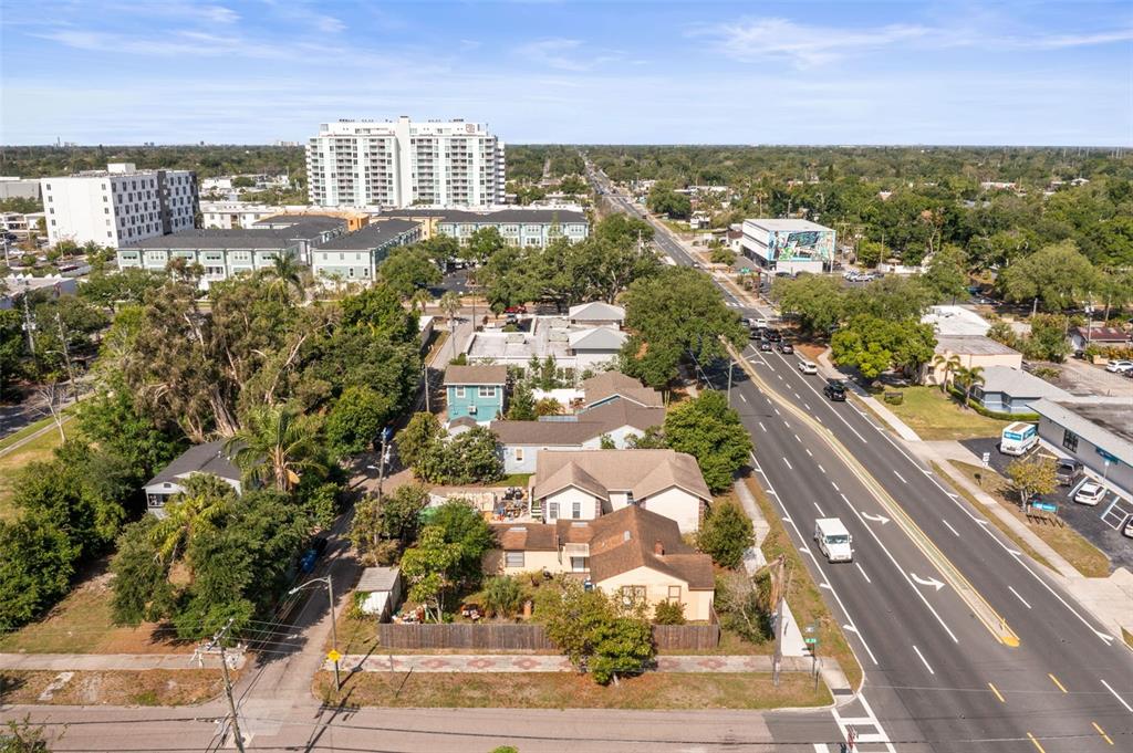 An aerial view shows a residential neighborhood with houses situated next to a multi-lane road — 3000 5TH AVENUE N, ST PETERSBURG, FL