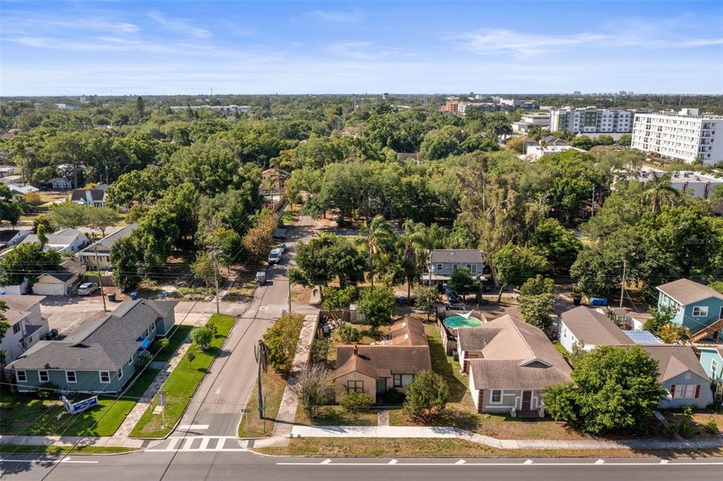 An aerial view shows a residential neighborhood with houses, trees, and a street — 3000 5TH AVENUE N, ST PETERSBURG, FL