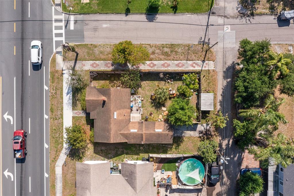 An aerial view shows a house with a brown roof, a yard, and a swimming pool — 3000 5TH AVENUE N, ST PETERSBURG, FL
