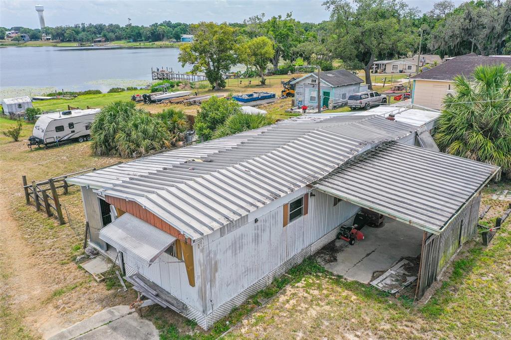 An aerial view of a mobile home with a metal roof and an attached carport — 4880 OLD LUCERNE PARK ROAD, WINTER HAVEN, FL
