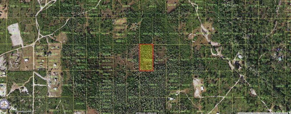 This is an aerial map showing a highlighted rectangular parcel of land surrounded by forest — HOLOPAW GROVES ROAD, ST CLOUD, FL