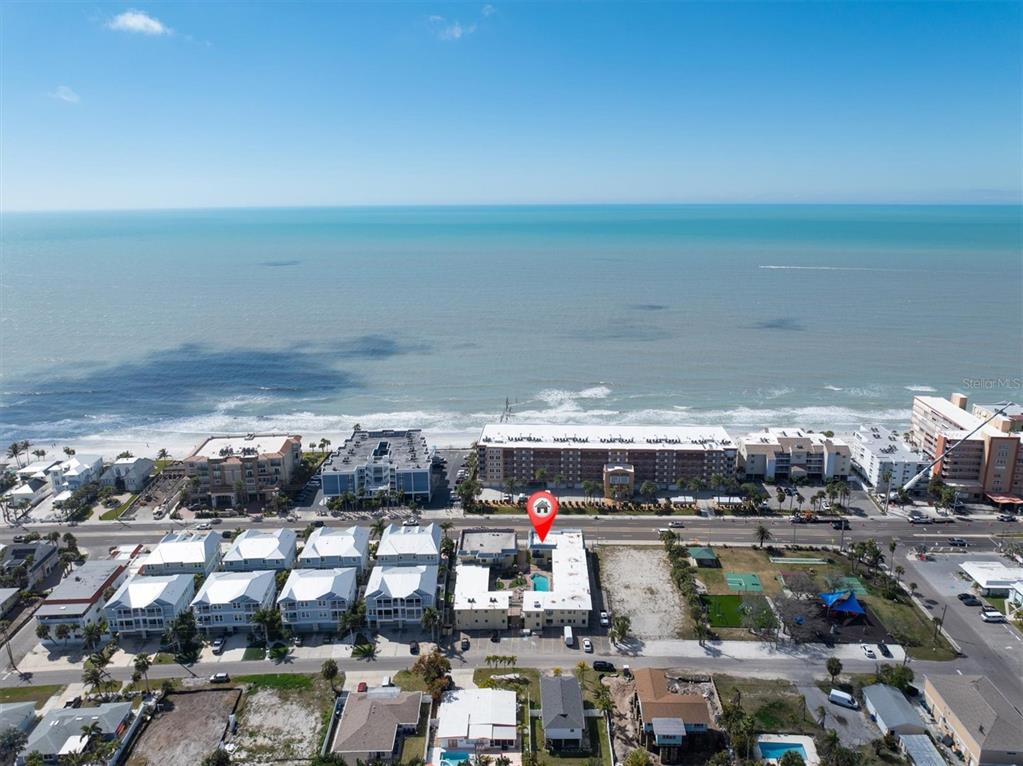 An aerial view shows a beachfront property with a red location pin — 16333 GULF BOULEVARD UNIT 201, REDINGTON BEACH, FL