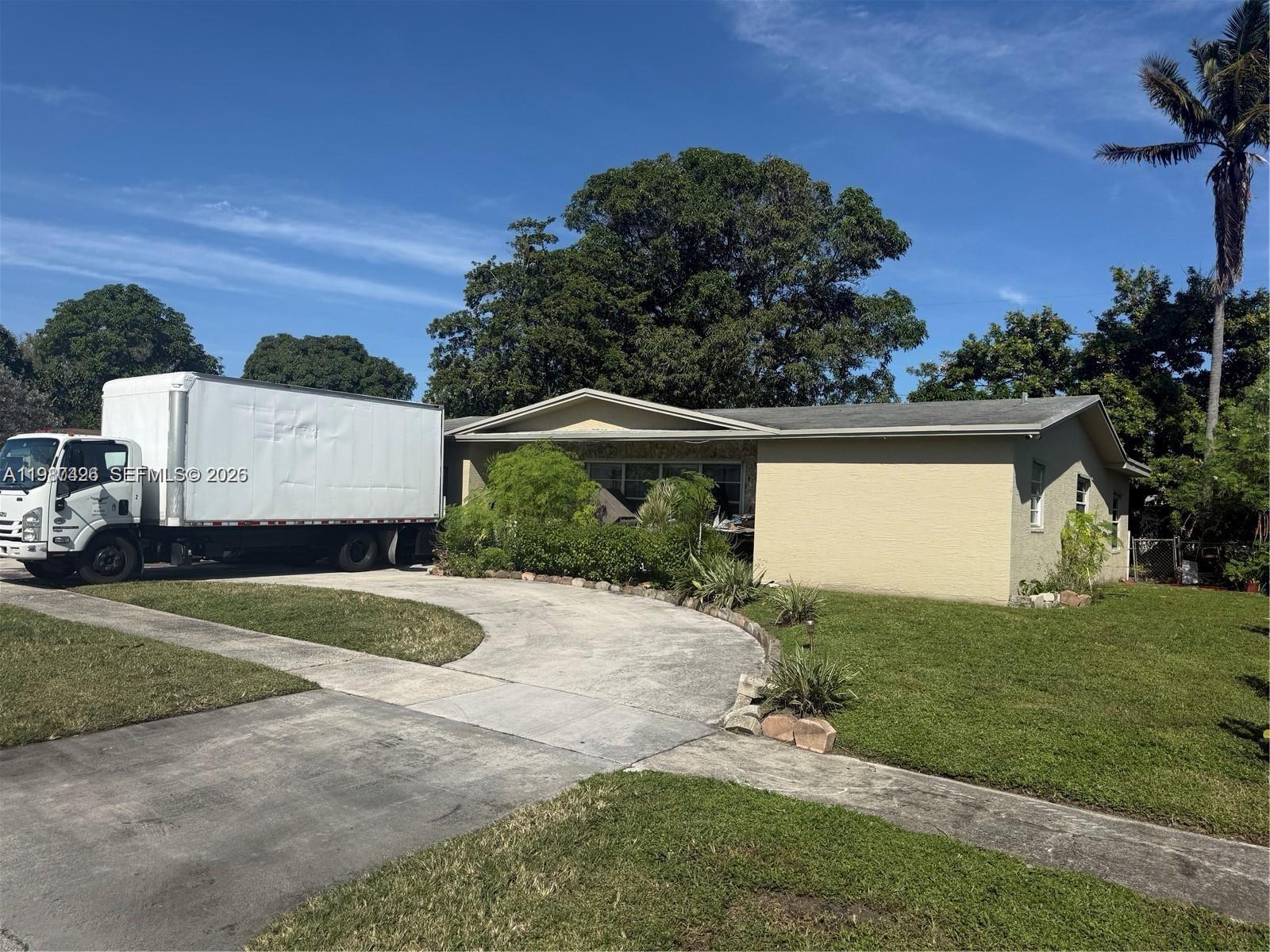A white box truck is parked on the driveway in front of a single-story house — 4741 NW 18th St, Lauderhill FL 33313, LAUDERHILL, FL