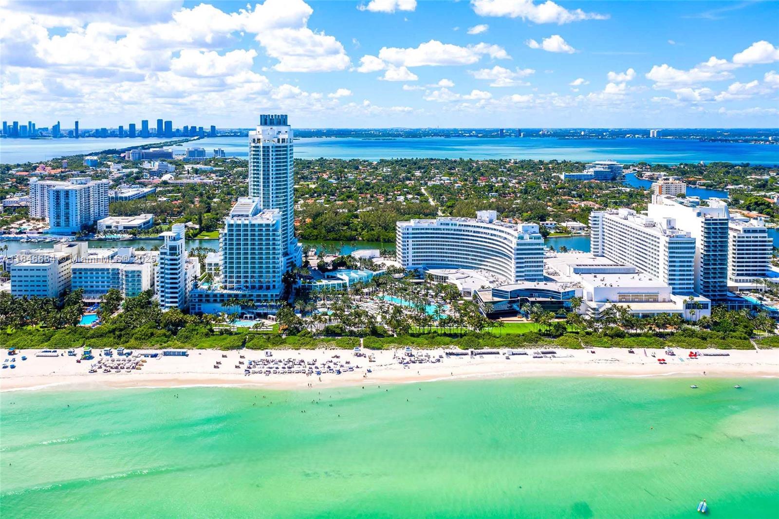 An aerial view of a beachfront resort with multiple high-rise buildings and a turquoise ocean — 4401 Collins Ave, Miami Beach FL 33140, MIAMI BEACH, FL