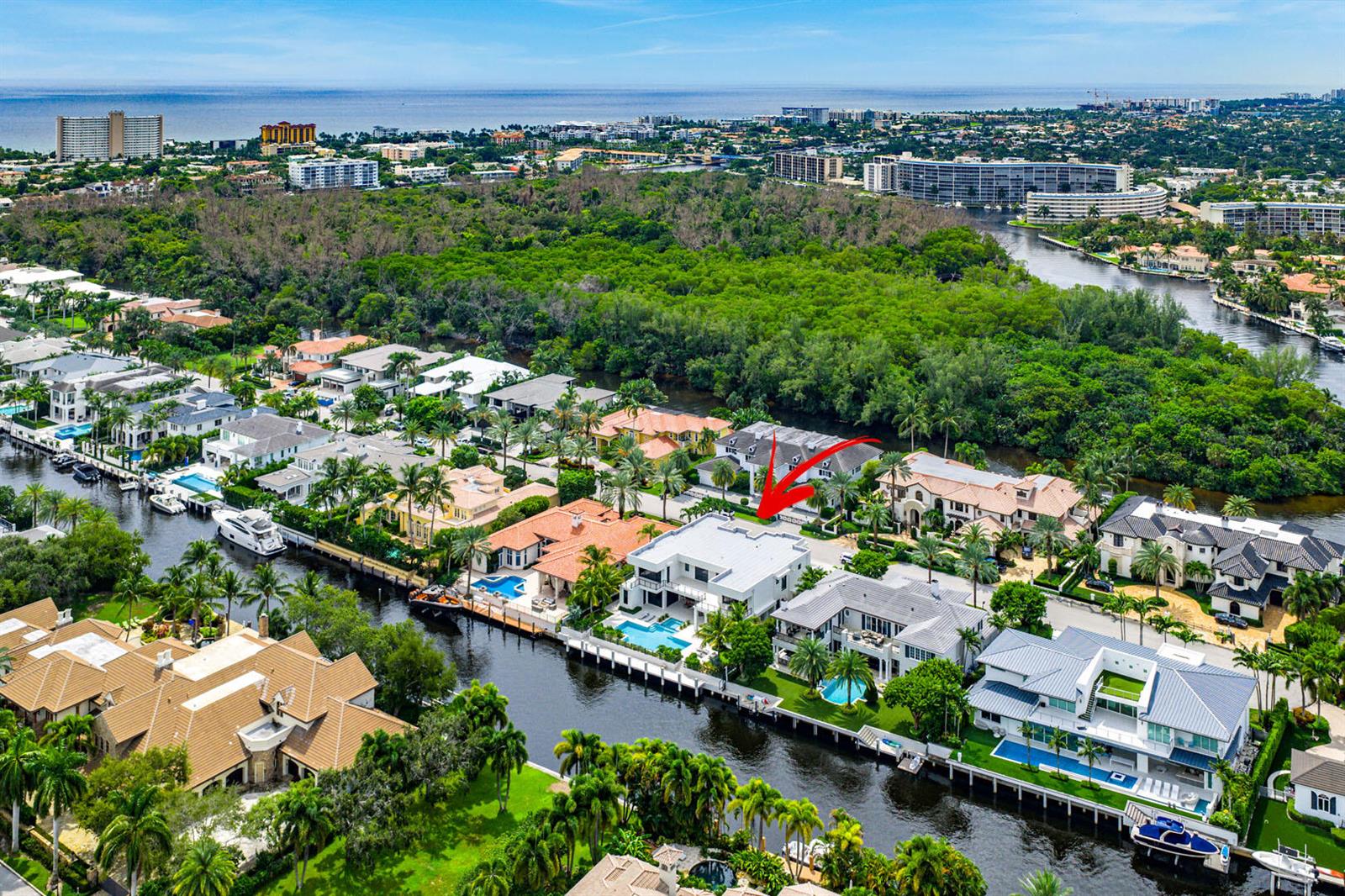 An aerial view of a modern white waterfront house with a pool and boat dock — 175 W Alexander Palm Road, Boca Raton FL 33432, BOCA RATON, FL