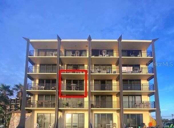 A multi-story beachfront condominium building features a red-outlined balcony on the third floor — 2301 S ATLANTIC AVENUE UNIT 303, DAYTONA BEACH SHORES, FL