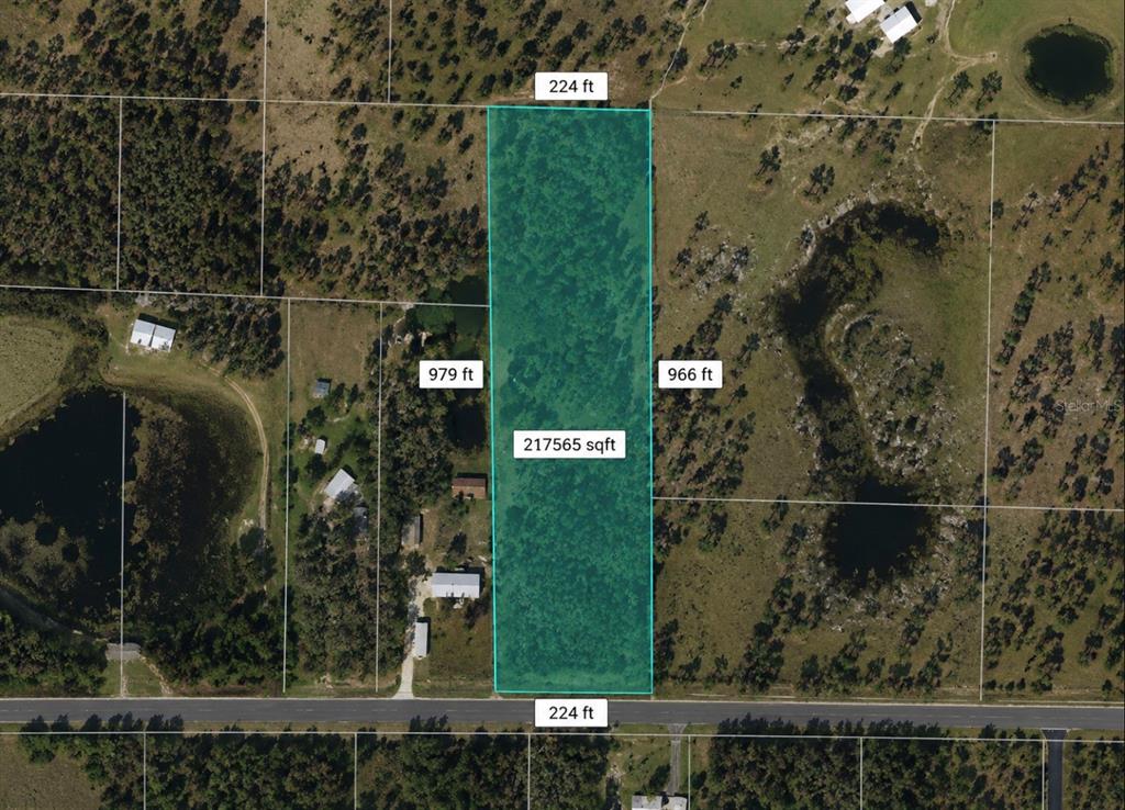 An aerial map shows a rectangular plot of land highlighted in blue with dimensions — 5499 E STOKES FERRY RD, HERNANDO, FL