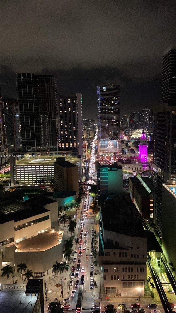 An elevated night view of a city street lined with skyscrapers and heavy traffic — 133 NE 2nd Ave # 2811, Miami FL 33132, MIAMI, FL