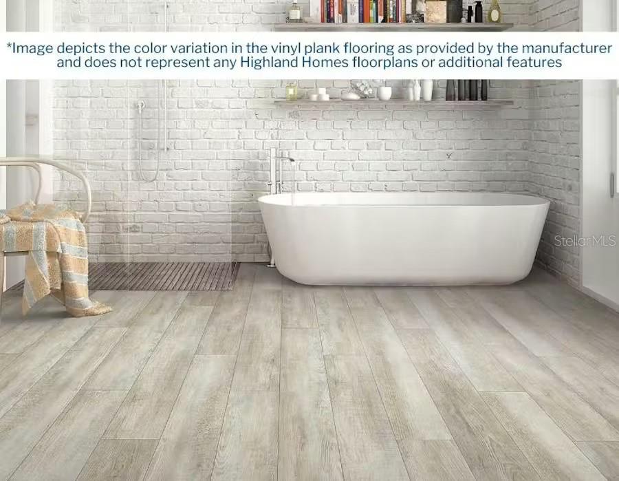 This rendering shows a bathroom with a freestanding tub, white brick walls, and wood-look flooring — 2814 58TH WAY E, PALMETTO, FL