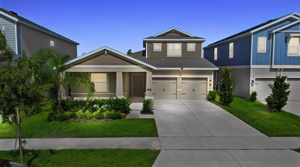 A single-story house with a two-car garage and a landscaped front yard — 16448 PARABLE WAY, WINTER GARDEN, FL