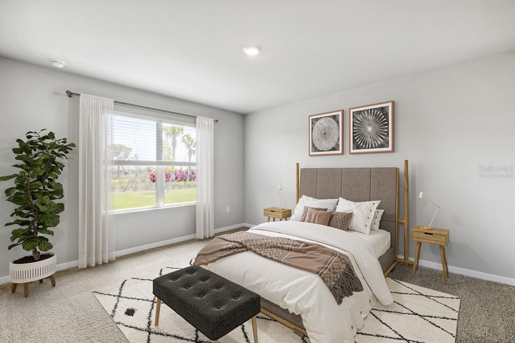 A bedroom features a bed with a gray headboard, two nightstands, and a large window — 26233 CORAL LAKES DRIVE, PUNTA GORDA, FL